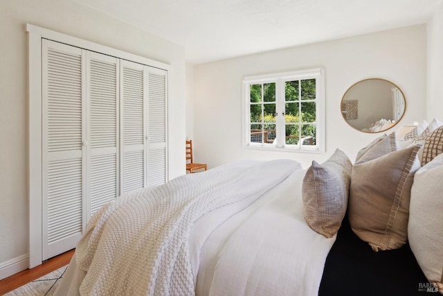 12 Jones Way, Larkspur, CA 94939 - bedroom featuring a closet, baseboards, and wood finished floors