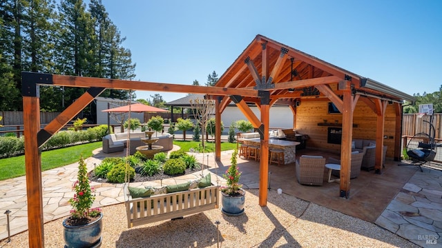 view of patio with a gazebo, outdoor lounge area, and a fenced backyard