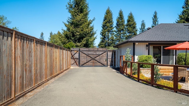 view of patio / terrace featuring fence and a gate