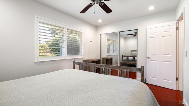 bedroom featuring dark wood-type flooring, ceiling fan, recessed lighting, and a closet