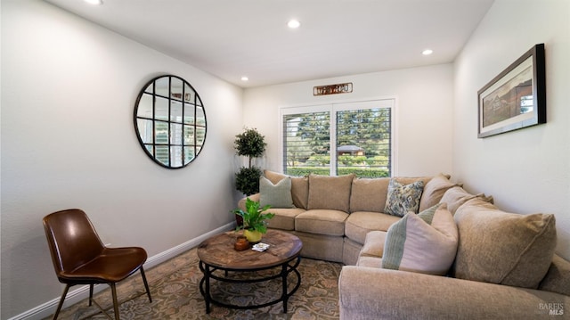living room featuring recessed lighting and baseboards
