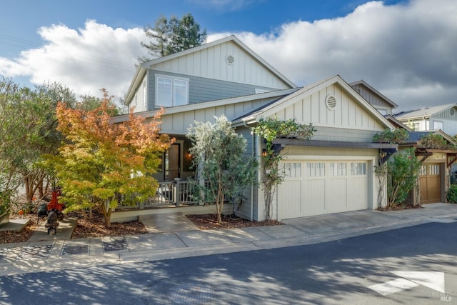 view of front facade featuring an attached garage, board and batten siding, and concrete driveway