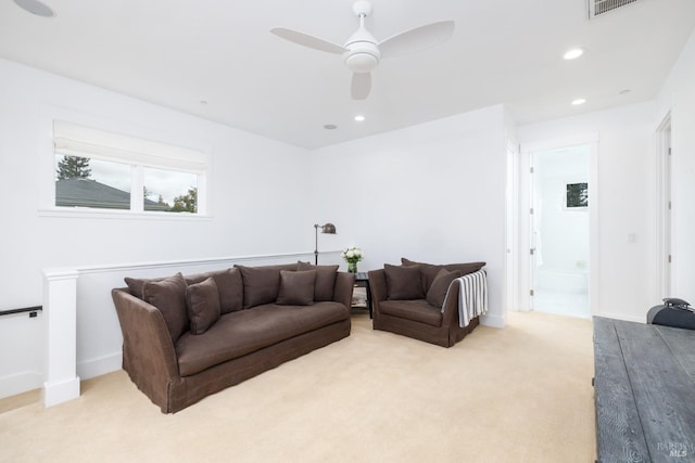 living area featuring recessed lighting, carpet, and a ceiling fan