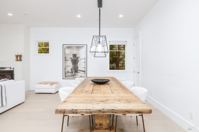 dining area with baseboards and recessed lighting