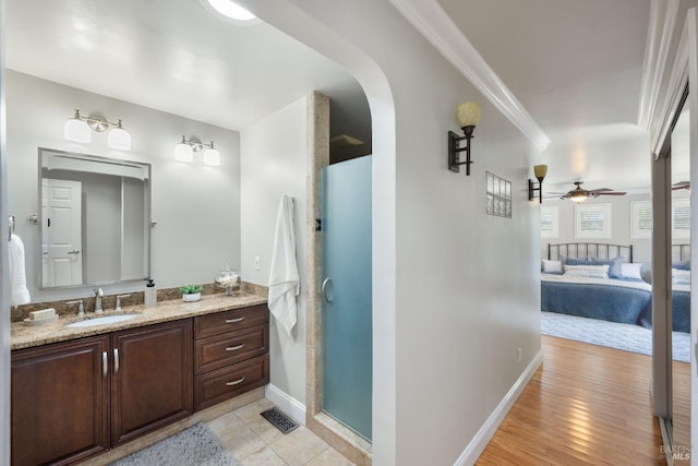 1036 Summit Ave, Napa, CA 94559 - full bathroom with baseboards, ceiling fan, vanity, a stall shower, and crown molding