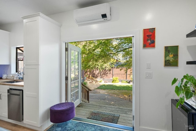 1036 Summit Ave, Napa, CA 94559 - entryway featuring a wall unit AC, a sink, healthy amount of natural light, and baseboards