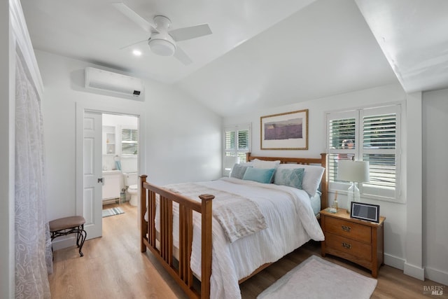 1036 Summit Ave, Napa, CA 94559 - bedroom with an AC wall unit, light wood-style floors, connected bathroom, lofted ceiling, and baseboards