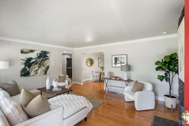 1036 Summit Ave, Napa, CA 94559 - living area featuring arched walkways, crown molding, light wood finished floors, and baseboards