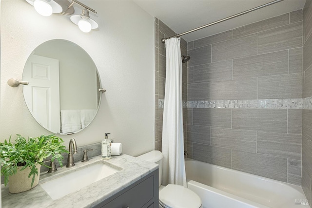 full bathroom featuring toilet, vanity, and shower / bath combination with curtain