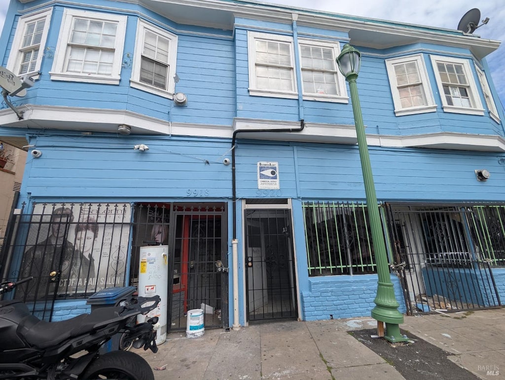 9920 International Blvd, Oakland, CA 94603 - multi unit property featuring gas water heater and a gate