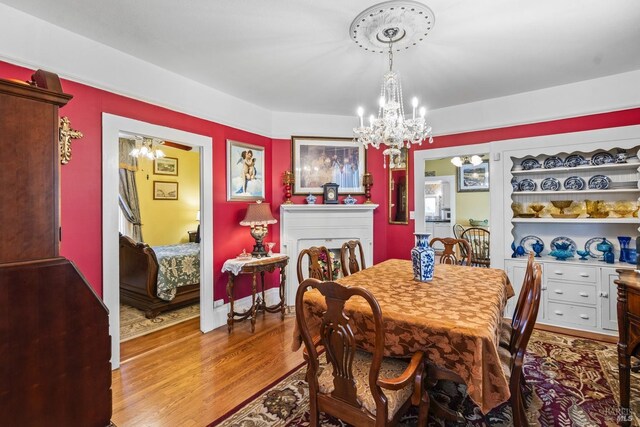 dining room featuring an inviting chandelier and wood finished floors