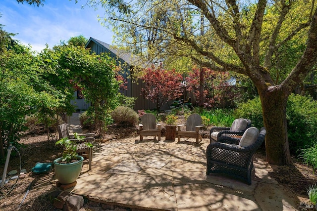 view of patio / terrace featuring fence