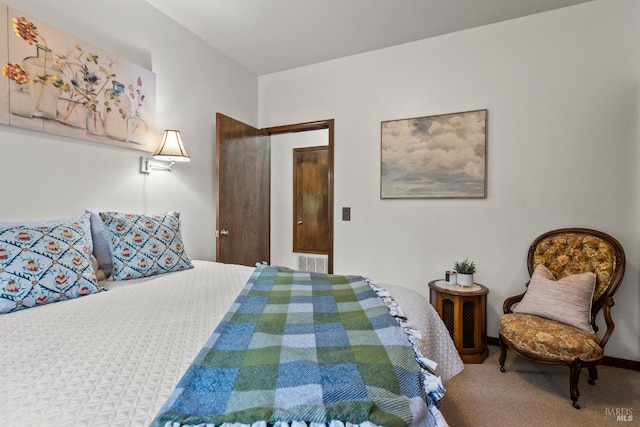 carpeted bedroom featuring visible vents