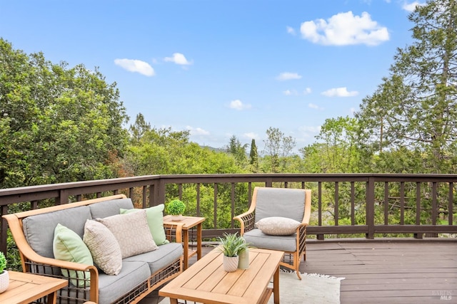wooden terrace with outdoor lounge area