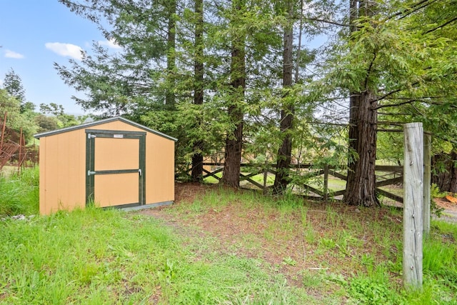 view of shed with fence