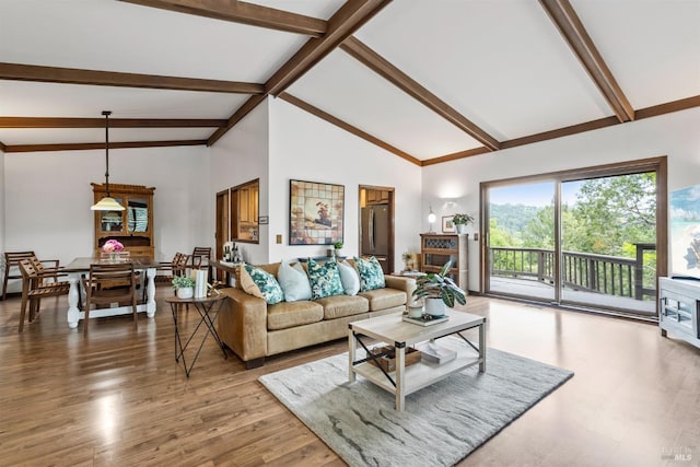 living room featuring beamed ceiling, high vaulted ceiling, and wood finished floors