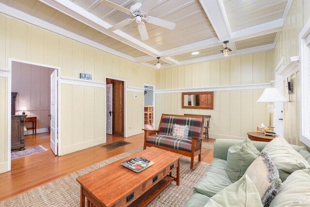 2410 S Fitch Mountain Rd, Healdsburg, CA 95448 - living room with coffered ceiling, beamed ceiling, ceiling fan, a decorative wall, and wood finished floors