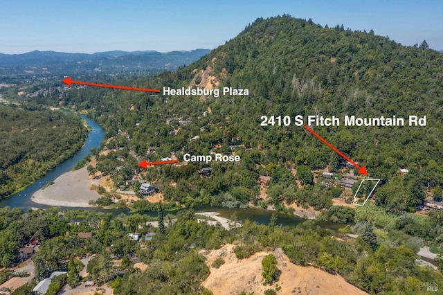 2410 S Fitch Mountain Rd, Healdsburg, CA 95448 - drone / aerial view featuring a view of trees and a water and mountain view