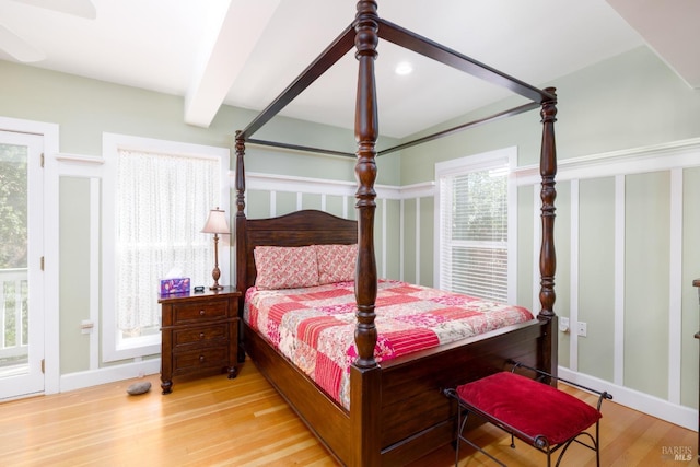 2410 S Fitch Mountain Rd, Healdsburg, CA 95448 - bedroom with light wood finished floors, baseboards, and beamed ceiling