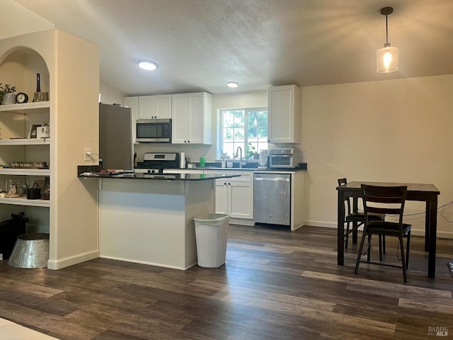 2032 Goose Rd, Willits, CA 95490 - kitchen with appliances with stainless steel finishes, white cabinetry, dark countertops, dark wood-type flooring, and recessed lighting