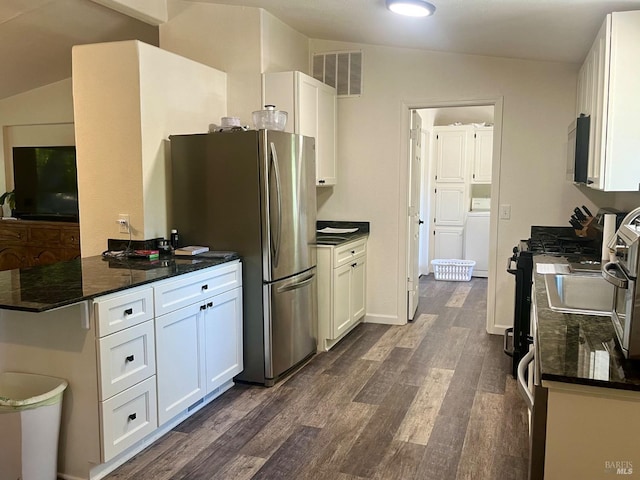 2032 Goose Rd, Willits, CA 95490 - kitchen with appliances with stainless steel finishes, washer / clothes dryer, dark wood-style floors, white cabinets, and a peninsula