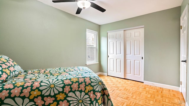 bedroom featuring baseboards, ceiling fan, and a closet