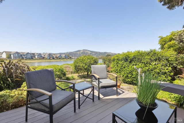 deck featuring a water and mountain view