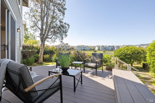 wooden deck featuring a residential view