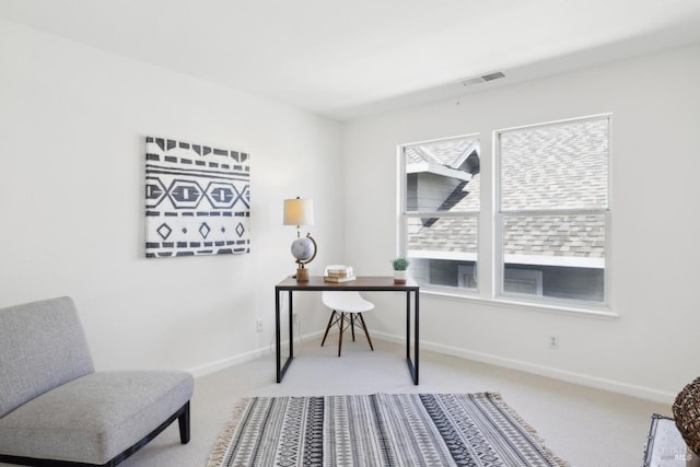 office with baseboards, visible vents, and carpet flooring