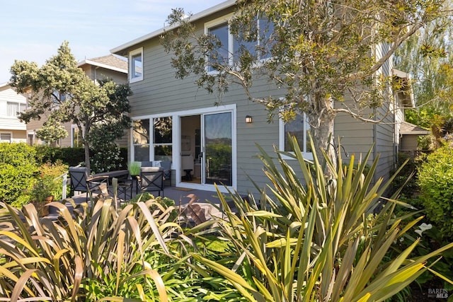 back of house with a patio area