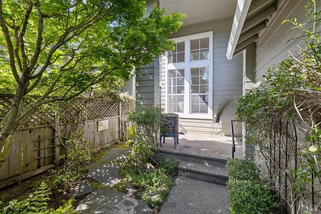 property entrance with fence