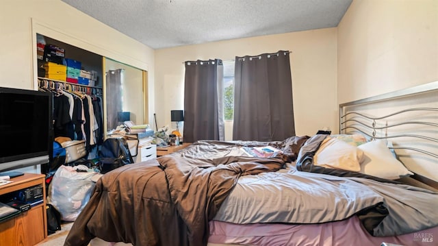 bedroom featuring a closet and a textured ceiling