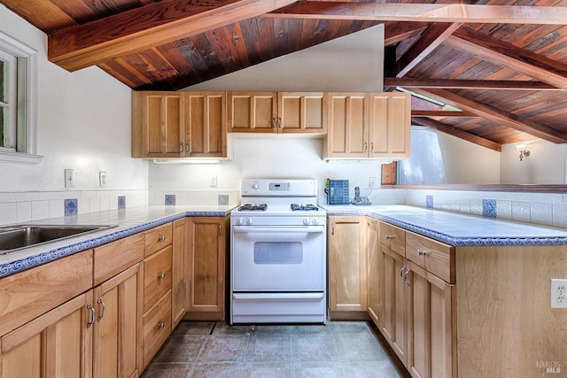 kitchen with a peninsula, wooden ceiling, lofted ceiling with beams, and white gas range