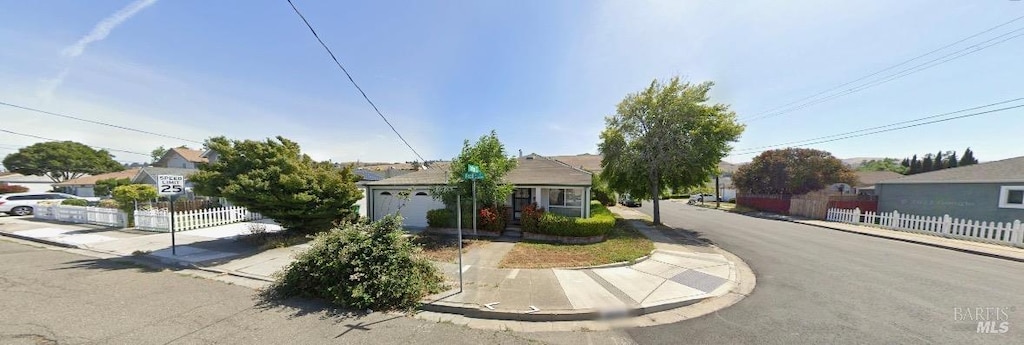 view of front of home with fence