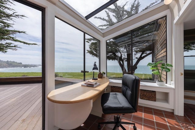 office space featuring a water view