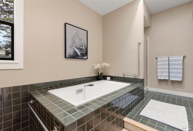 bathroom featuring tile patterned floors and a garden tub