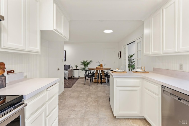 1009 Tilton Rd, Sebastopol, CA 95472 - kitchen with stainless steel appliances, light countertops, and white cabinetry