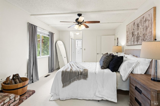 1009 Tilton Rd, Sebastopol, CA 95472 - bedroom featuring carpet floors, ceiling fan, a textured ceiling, ensuite bath, and beamed ceiling