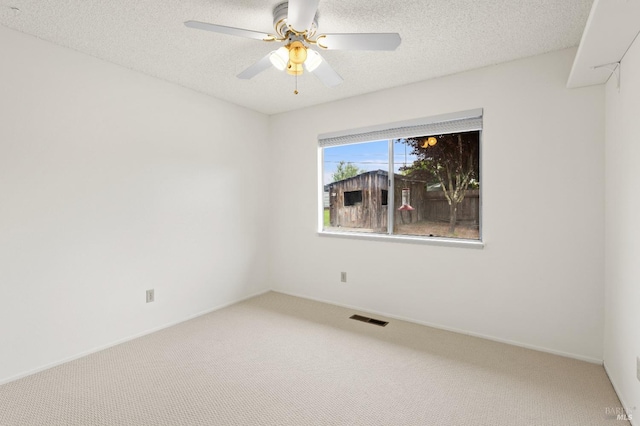 1009 Tilton Rd, Sebastopol, CA 95472 - spare room with carpet floors, a textured ceiling, a ceiling fan, and baseboards