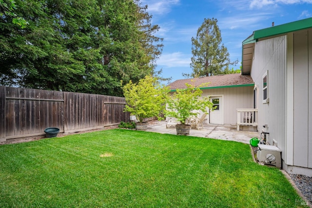 view of yard featuring a patio and a fenced backyard