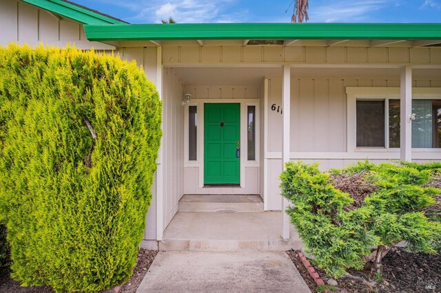 entrance to property featuring board and batten siding