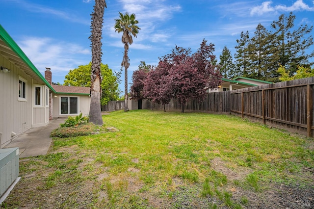 view of yard with a fenced backyard