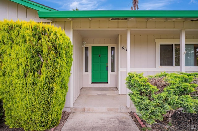doorway to property with board and batten siding