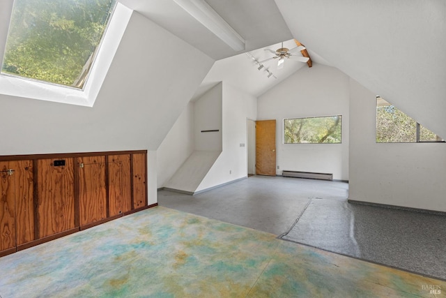 bonus room with baseboard heating, ceiling fan, baseboards, and vaulted ceiling with skylight
