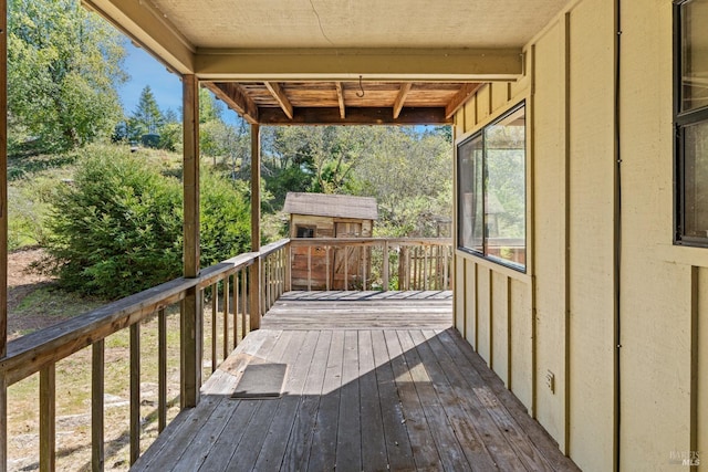 wooden deck featuring an outdoor structure