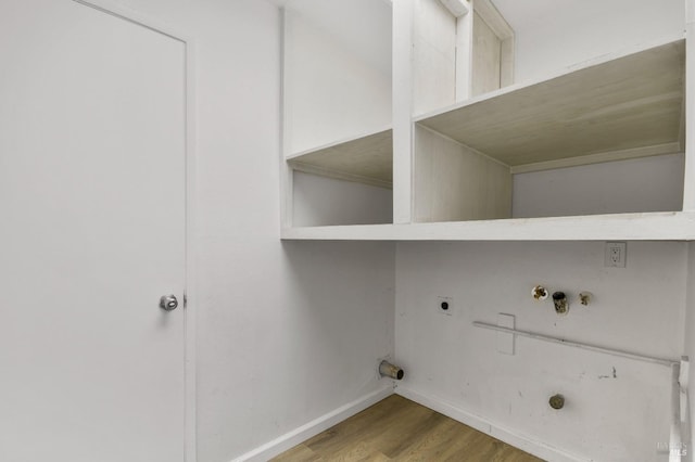 washroom featuring laundry area, wood finished floors, hookup for a gas dryer, hookup for a washing machine, and electric dryer hookup