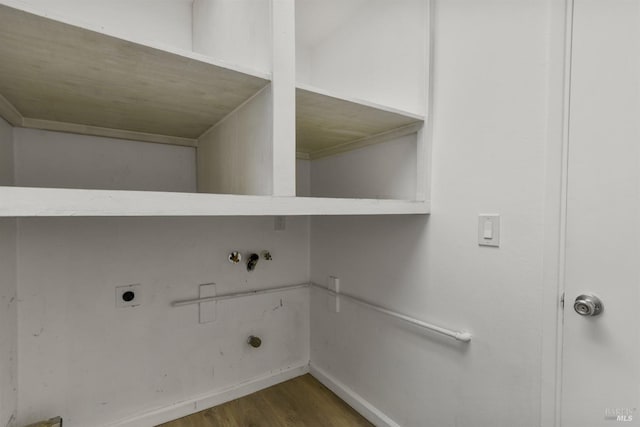 clothes washing area with laundry area, wood finished floors, hookup for an electric dryer, hookup for a washing machine, and baseboards