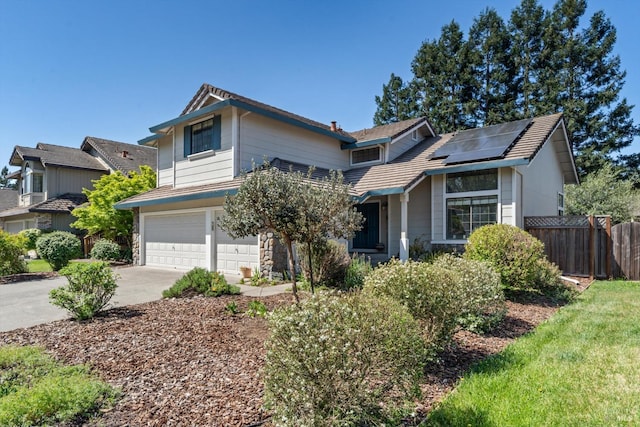 7350 Rasmussen Way, Rohnert Park, CA 94928 - view of front of house featuring fence, an attached garage, driveway, and roof mounted solar panels