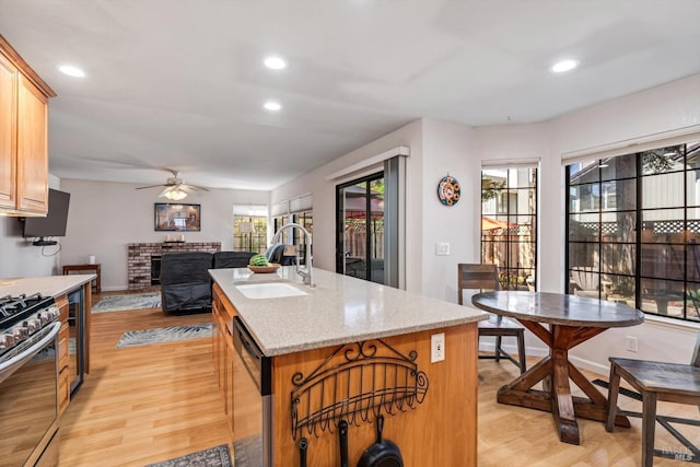 7350 Rasmussen Way, Rohnert Park, CA 94928 - kitchen featuring a ceiling fan, a sink, a kitchen island with sink, appliances with stainless steel finishes, and recessed lighting