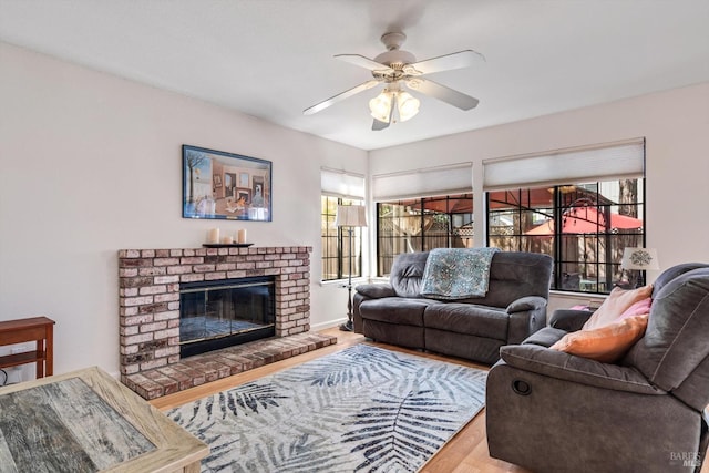 7350 Rasmussen Way, Rohnert Park, CA 94928 - living area with wood finished floors, a brick fireplace, ceiling fan, and plenty of natural light